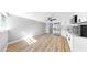Spacious living room next to a modern kitchen with stainless steel appliances at 829 Riverside Dr, Tarpon Springs, FL 34689