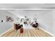 Open-concept living room featuring wood flooring and large windows at 829 Riverside Dr, Tarpon Springs, FL 34689