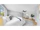 Bright main bedroom featuring neutral walls, a ceiling fan, and wood-look floors at 829 Riverside Dr, Tarpon Springs, FL 34689