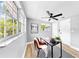 Office featuring a ceiling fan, and large windows allowing for ample natural light at 829 Riverside Dr, Tarpon Springs, FL 34689