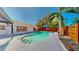 Backyard pool with a new deck, integrated steps, and blue shade cover at 829 Riverside Dr, Tarpon Springs, FL 34689