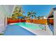 Backyard pool with new deck, blue shade and mature trees for shade at 829 Riverside Dr, Tarpon Springs, FL 34689