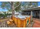 Enjoy a dip in this backyard featuring a brick patio and wooden hot tub at 9611 107Th N Ave, Largo, FL 33773