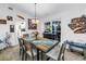 Inviting dining room featuring a large window for natural light and eye-catching decor including fish art at 9611 107Th N Ave, Largo, FL 33773