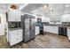 Bright kitchen featuring white cabinets, granite countertops, stainless steel appliances, and decorative backsplash at 9611 107Th N Ave, Largo, FL 33773