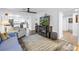 Bright and airy living room with fireplace and seamless flow to the modern kitchen offering space to entertain at 9611 107Th N Ave, Largo, FL 33773