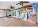 Bright, screened porch with ceiling fans, outdoor furniture, and tropical decor at 9611 107Th N Ave, Largo, FL 33773