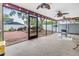 Large screened porch with plenty of space for outdoor living and dining at 9611 107Th N Ave, Largo, FL 33773