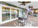 Covered patio with ceiling fans, outdoor furniture, and sliding door access to the main home at 9611 107Th N Ave, Largo, FL 33773