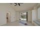 Spacious bonus room featuring tile floors, large windows overlooking the pool, and vaulted ceiling at 987 Chickadee Dr, Venice, FL 34285