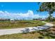 Picturesque golf course view with a walking path and pond, perfect for leisurely strolls at 987 Chickadee Dr, Venice, FL 34285