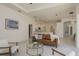Spacious living room with open floor plan and view of kitchen at 987 Chickadee Dr, Venice, FL 34285