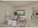 Comfortable living room with modern decor, plush seating, and a view of the pool area at 987 Chickadee Dr, Venice, FL 34285