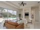 Cozy living room featuring sliding doors to pool and built-in shelving at 987 Chickadee Dr, Venice, FL 34285