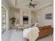 Bright living room with decorative ceiling, built-in shelves, and modern furniture at 987 Chickadee Dr, Venice, FL 34285