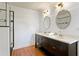 Updated bathroom with a dual sink vanity at 1003 E Emma St, Tampa, FL 33603