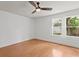 Bright bedroom with a ceiling fan and hardwood floors at 1003 E Emma St, Tampa, FL 33603