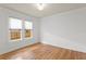 Bright bedroom with hardwood floors and natural light from the window at 1003 E Emma St, Tampa, FL 33603