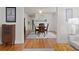 Dining room with hardwood floors, neutral walls and decor, seamless flow to living room at 1003 E Emma St, Tampa, FL 33603
