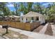 Well-maintained home with a cozy front porch and a stylish horizontal wood fence at 1003 E Emma St, Tampa, FL 33603