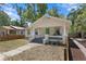Inviting home with a quaint front porch, classic architectural details, and a vibrant front door at 1003 E Emma St, Tampa, FL 33603