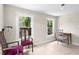 Inviting living room featuring tiled floors, neutral walls, and natural light from bright windows at 1003 E Emma St, Tampa, FL 33603