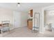 Versatile space offering tile floors, ample light, kitchen access, and a bathroom entrance at 1003 E Emma St, Tampa, FL 33603