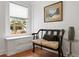 Sitting area showcasing a bench, artwork, and window with natural light at 1003 E Emma St, Tampa, FL 33603