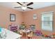 Bright, inviting playroom with toys, books, and a table perfect for creative activities at 10104 Carloway Hills Dr, Wimauma, FL 33598