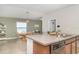 A modern kitchen with granite countertops and stainless steel appliances offers ample space and style at 10104 Carloway Hills Dr, Wimauma, FL 33598