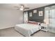 Relaxing primary bedroom featuring neutral colors, soft lighting, and comfortable furnishings at 10104 Carloway Hills Dr, Wimauma, FL 33598