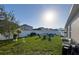 Well-maintained backyard with lush green grass, a seating area, and privacy fencing, ideal for outdoor living at 10123 Carp Hollow Rd, Sun City Center, FL 33573