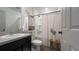 Bathroom with a shower and bathtub, vanity, and modern fixtures at 10123 Carp Hollow Rd, Sun City Center, FL 33573