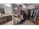 Spacious walk-in closet with ample storage shelves and hanging space at 10123 Carp Hollow Rd, Sun City Center, FL 33573
