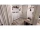 Bright laundry room featuring a white washer and dryer, shelving, and stylish decor accents at 10123 Carp Hollow Rd, Sun City Center, FL 33573