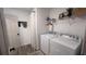 Efficient laundry room showcasing modern appliances, ample shelving, and a clean, organized space at 10123 Carp Hollow Rd, Sun City Center, FL 33573