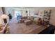 Spacious living room featuring a large sectional sofa and open layout at 10123 Carp Hollow Rd, Sun City Center, FL 33573