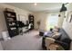Home office with modern desk, comfortable seating, and natural light from the window at 10123 Carp Hollow Rd, Sun City Center, FL 33573