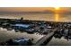 An elevated shot captures a coastal town at sunset, highlighting the marina, bridge, and tranquil waterfront at 10340 2Nd N Way, St Petersburg, FL 33716