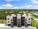 Aerial view showcasing the contemporary townhome architecture and lush surroundings of the community at 10340 2Nd N Way, St Petersburg, FL 33716