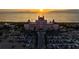 A stunning aerial view showcases a beachfront hotel at sunset, complete with palm trees and parking at 10340 2Nd N Way, St Petersburg, FL 33716