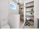 Stylish bathroom showcases a glass shower with a rain shower head and built-in shelves for storage at 10340 2Nd N Way, St Petersburg, FL 33716