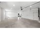 Bright, spacious garage with ample room for parking and storage, with neutral color scheme and recessed lighting at 10340 2Nd N Way, St Petersburg, FL 33716