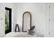 Gym area with fitness equipment, yoga mat, water bottles, and mirrors, flooded with natural light at 10340 2Nd N Way, St Petersburg, FL 33716