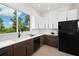 Contemporary kitchen featuring sleek, two-tone cabinetry and stainless steel appliances at 10340 2Nd N Way, St Petersburg, FL 33716