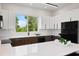 Stylish kitchen featuring modern appliances, sleek cabinetry, and a bright, airy atmosphere at 10340 2Nd N Way, St Petersburg, FL 33716