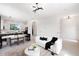 Bright, open-concept living area with a modern kitchen, stylish seating, and elegant lighting fixtures at 10340 2Nd N Way, St Petersburg, FL 33716