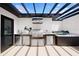 Stylish rooftop with outdoor kitchen featuring modern appliances, a grill, and a hot tub for relaxation at 10340 2Nd N Way, St Petersburg, FL 33716