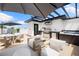 Outdoor kitchen, dining, and lounging on rooftop deck featuring a built-in grill and hot tub at 10340 2Nd N Way, St Petersburg, FL 33716