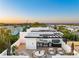 Luxury rooftop deck showcasing a hot tub, outdoor kitchen and furniture, perfect for entertaining and relaxing at 10340 2Nd N Way, St Petersburg, FL 33716